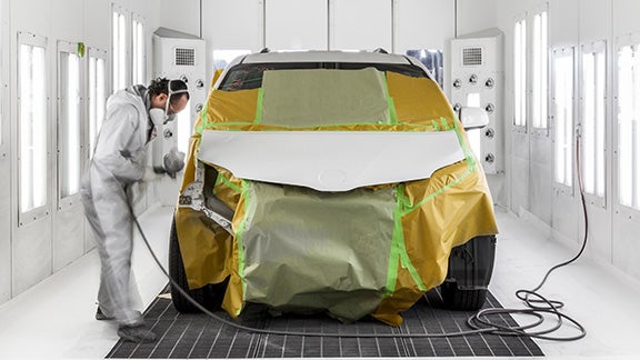 Collision Center Technician Painting a Vehicle | Ed Martin Toyota in Noblesville IN