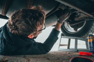 Man fixing a Toyota vehicle near Noblesville, IN