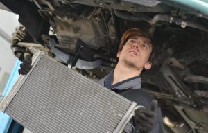 Mechanic working on a radiator near Noblesville, Indiana