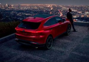 A red 2023 Toyota Venza parked on an overlook near Noblesville, Indiana.