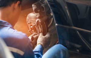 A person fixing a car's brakes near Noblesville, Indiana.