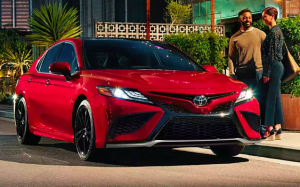 A 2024 Toyota Camry parked near two people near Noblesville, Indiana