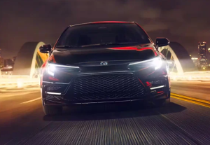 A 2024 Toyota Corolla driving down a highway at night near Noblesville, Indiana.