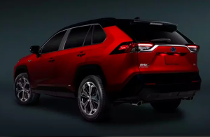 A rear view of a red 2024 Toyota RAV4 Prime parked in front of a grey background near Orangeburg, South Carolina