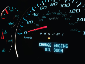 A dashboard message saying "CHANGE OIL SOON" near Noblesville, IN