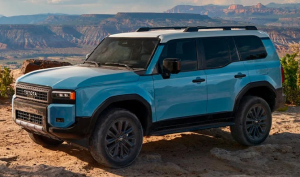 A blue 2024 Toyota Land Cruiser parked on a dirt road near Noblesville, Indiana