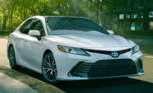 A white 2024 Toyota Camry Hybrid parked on a street near Noblesville, Indiana