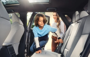 An interior shot of a 2024 Toyota bZ4X while a family gets into the back seat near Noblesville, IN. 