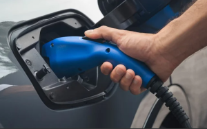 A person plugging in their 2025 Toyota Prius Plug-in Hybrid near Noblesville, Indiana