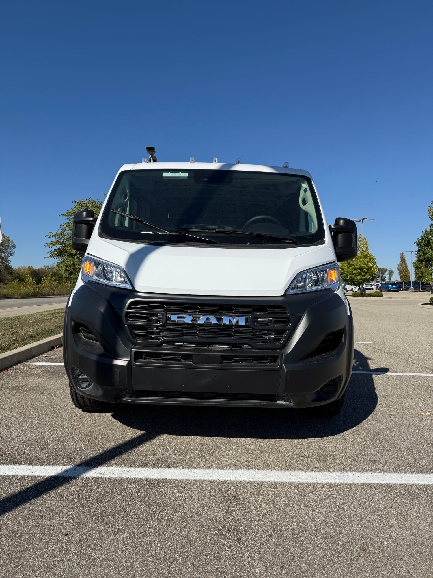 Front view of white Ram ProMaster 1500 van