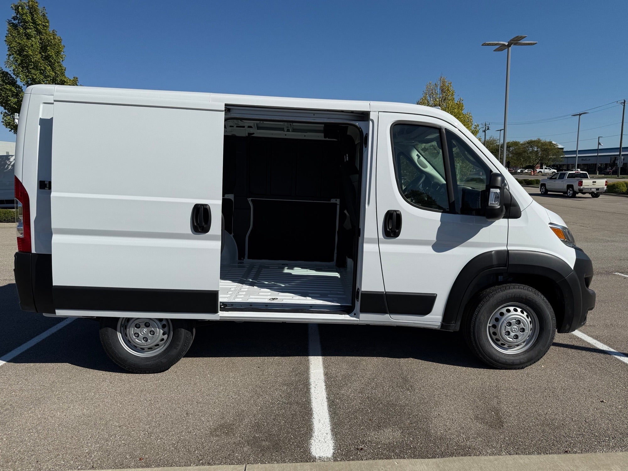 Side view of Ram ProMaster 1500 with open sliding door