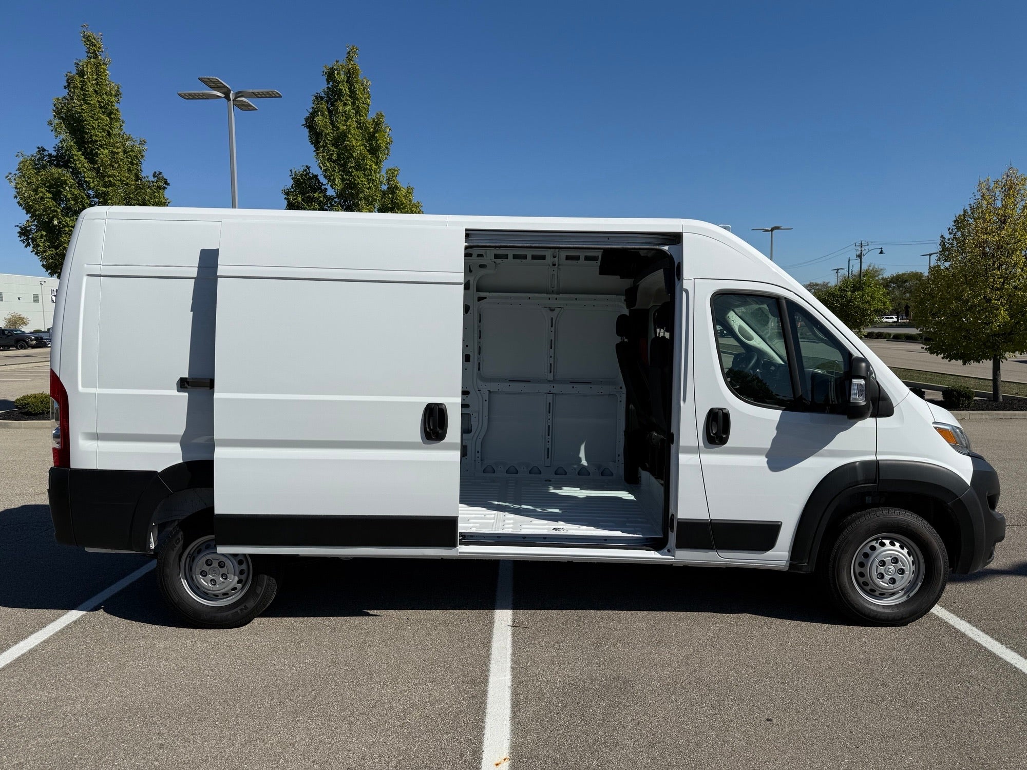 Side view of Ram ProMaster 2500 with open sliding door