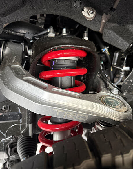 Close up of a RD suspension lift kit in silver or chrome