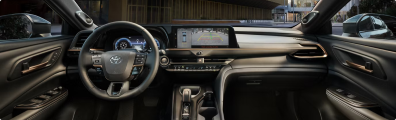 Crown Signia dashboard from the rear seat, with the wide centre screen showing the backup camera