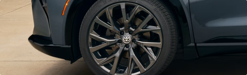Close-up of a Crown Signia alloy wheel and front bumper