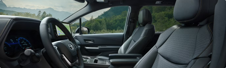 Toyota Sienna front cabin with mountains visible through the windows
