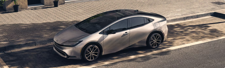 Silver Toyota Prius parked at a kerb, seen from above
