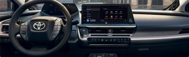 Toyota Prius dashboard with the centre touchscreen showing an audio menu